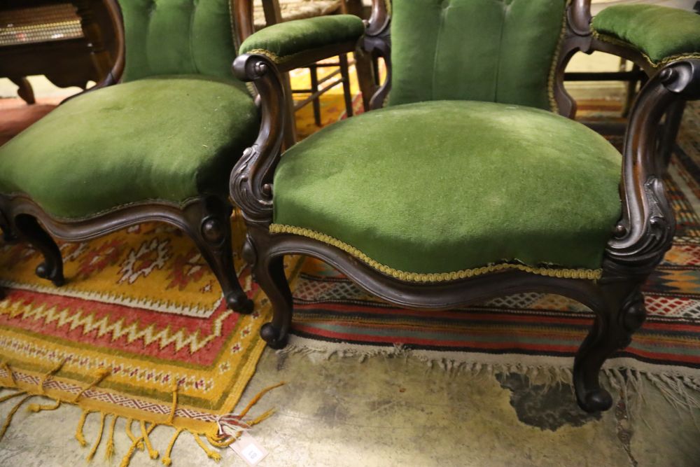A pair of Victorian mahogany spoonback chairs, one with arms